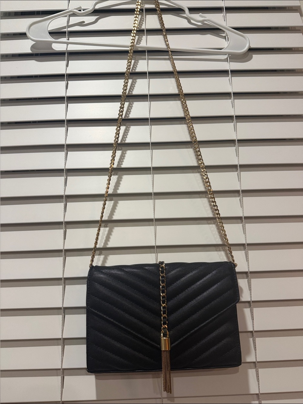 Elegant Black Quilted Crossbody Bag with Gold Chain and Tassel